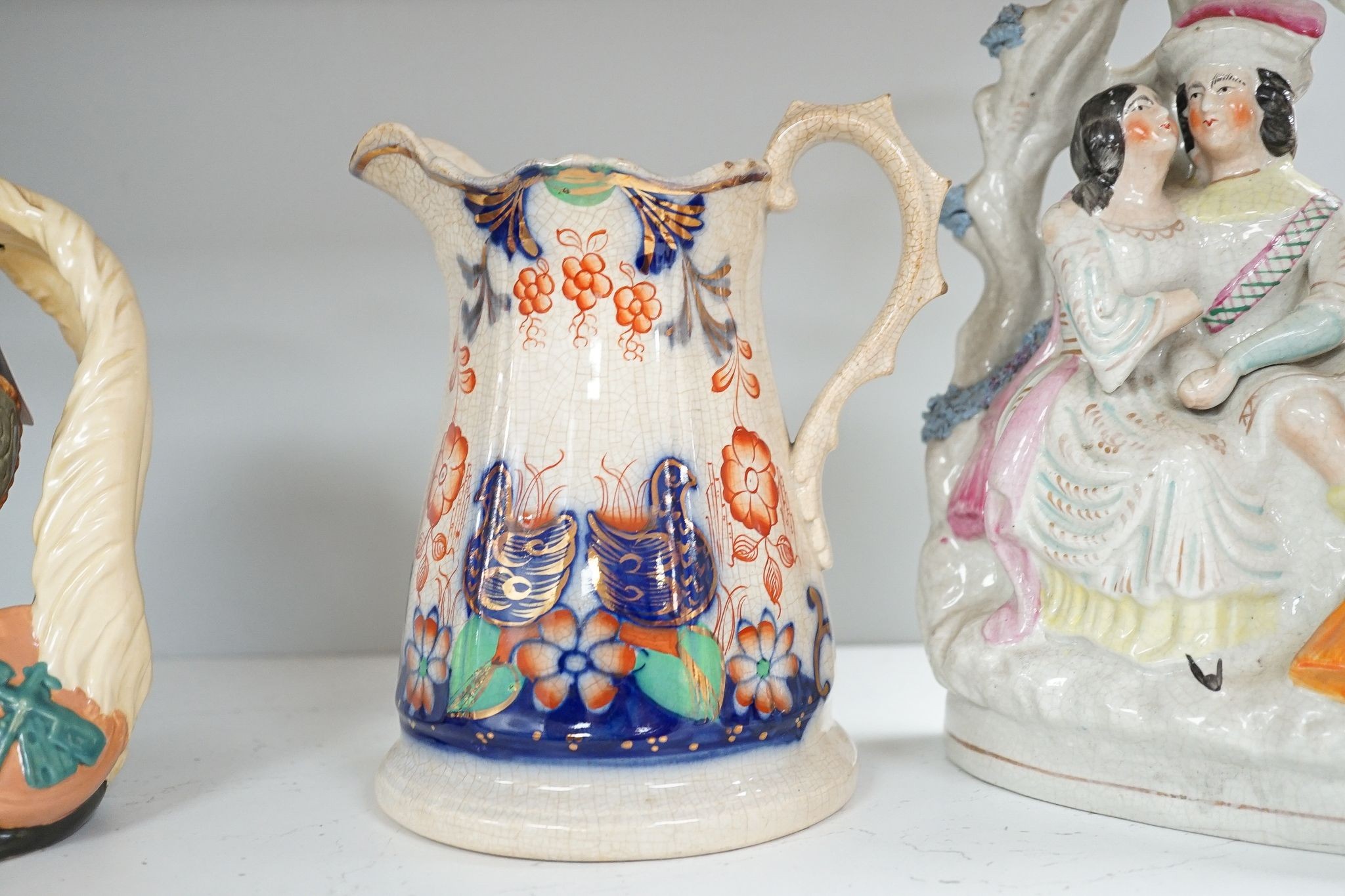 A Royal Doulton character jug and 6 other pieces including a Staffordshire figure group, tallest 25cm